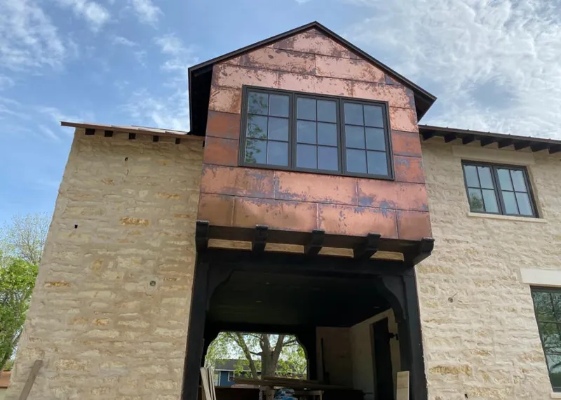 Copper metal panel facade on a stone building for Metal Roof Coating in Pine Castle